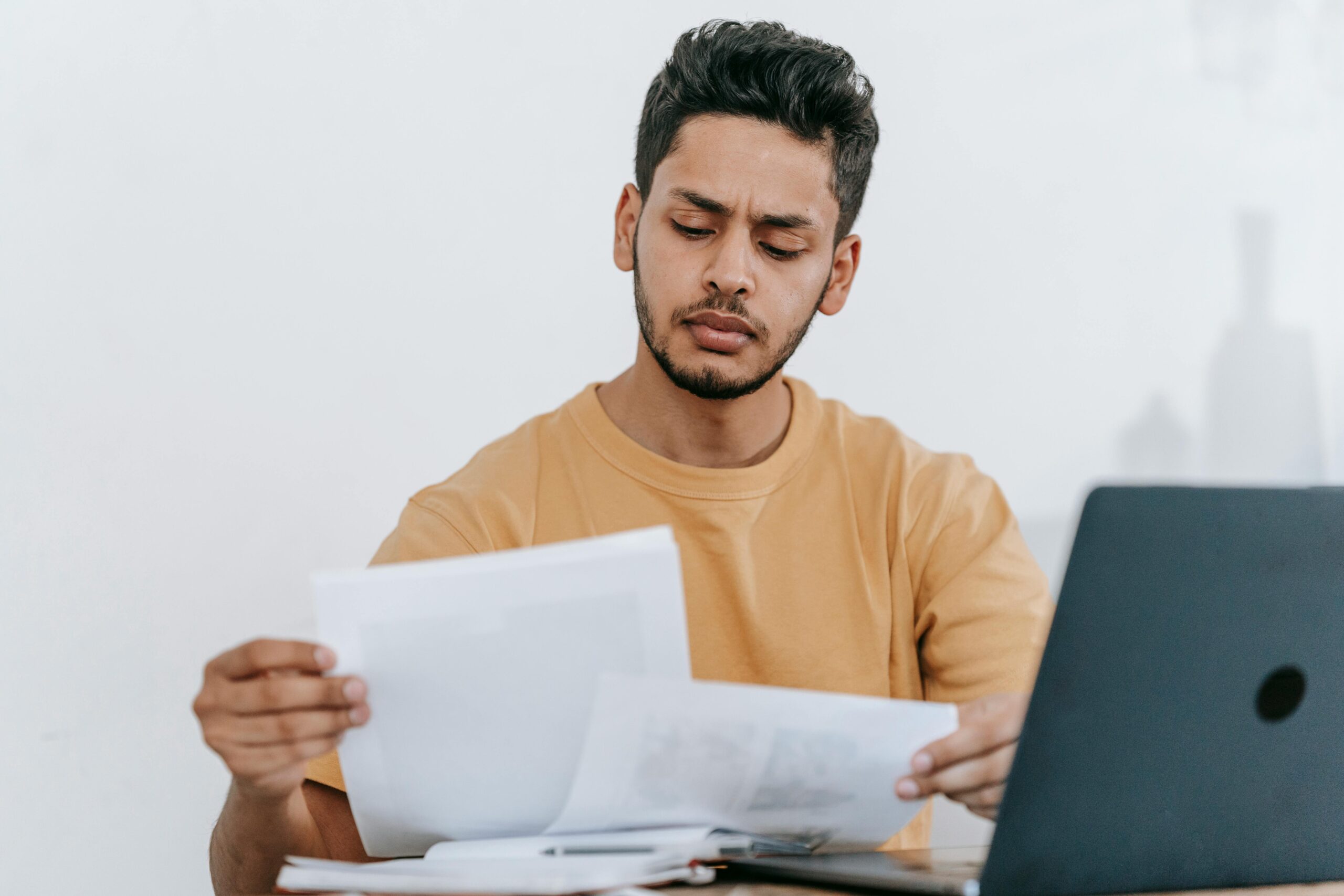 Person checking their finances on a laptop